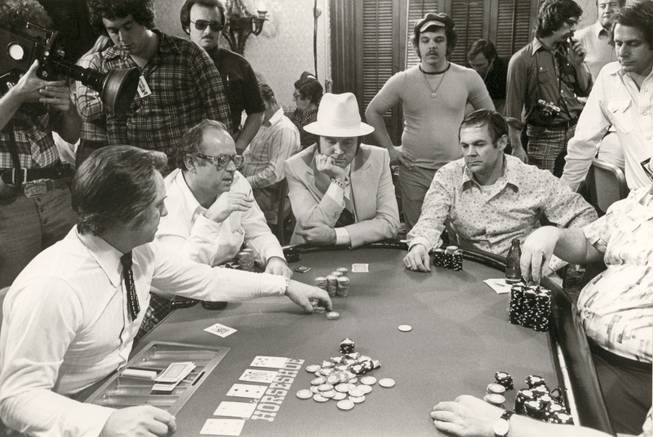 A crowd of spectators gathers around a table during the seventh World Series of Poker held at Binion's Horseshoe in1976. Doyle Brunson ultimately walked away the champion, earning him the top prize of $220,000 and the first of his 10 World Series bracelets.
