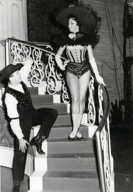 A burlesque cowgirl seduces audiences and actors alike during the first topless show in town, 