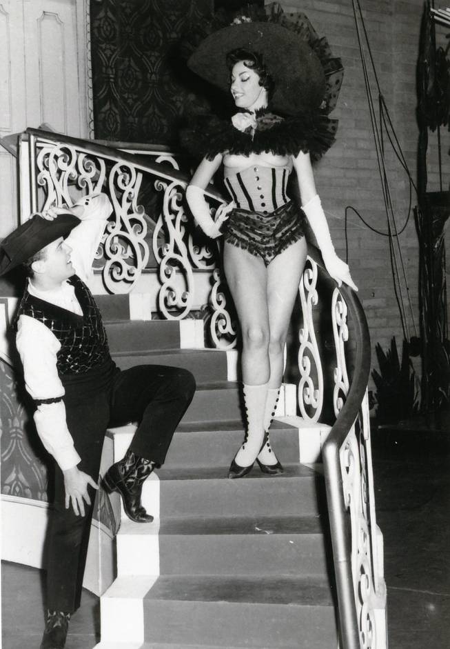 A burlesque cowgirl seduces audiences and actors alike during the first topless show in town, "Minsky's Folies," at the Dunes. Harold Minsky moved the show to Las Vegas in 1957 after his show was driven out of New York for being too raunchy.  