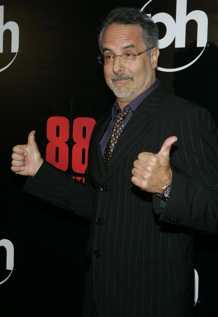Director Jon Avnet gives a thumbs up on the red carpet during the movie premiere of  