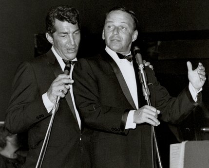 Frank Sinatra and Dean Martin sing a duet together during a 1960s performance in the Sands' Copa Room. The Rat Pack was born when Sinatra joined Martin onstage to sing 