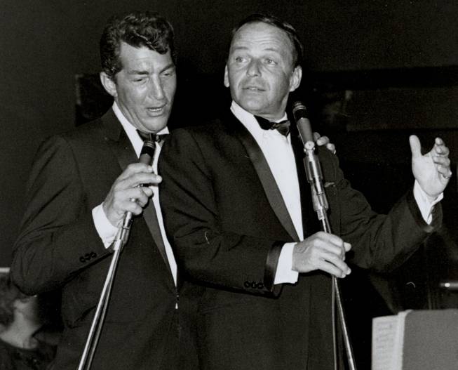 Frank Sinatra and Dean Martin sing a duet together during a 1960s performance in the Sands' Copa Room. The Rat Pack was born when Sinatra joined Martin onstage to sing "Sleep Warm" at the Sands on Jan. 20, 1960.