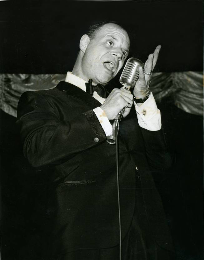 Comedian Don Rickles projects his voice into the microphone during one of his numerous performances.  Rickles has also enjoyed success in television and film over his long career as an entertainer. Younger audiences would best recognize his voice as Mr. Potato Head's in the "Toy Story" series.