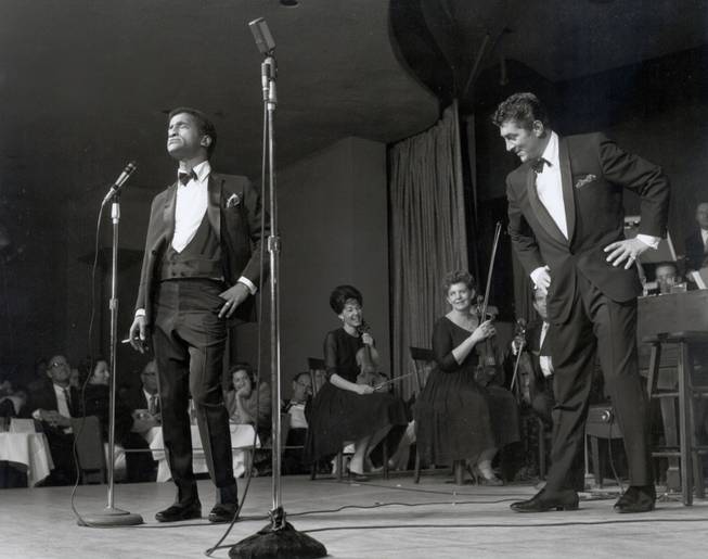 Dean Martin (right) teases Sammy Davis Jr. during a 1960's performance. Dino would become famous for ridiculing his peers during his Celebrity Roasts, where he and a panel of famous friends would honor a celebrity with mercilessly funny insults.