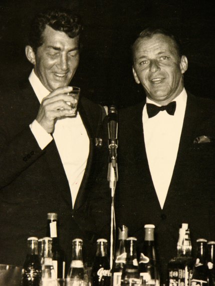 Dean Martin and Frank Sinatra perform together and drink together at December 13, 1983 performance. That same month Sinatra was named as a recipient of the Kennedy Center Honors, a prestigious honor given to American performing artists.