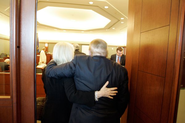 Las Vegas Sands Corp. Chairman Sheldon Adelson, right, is assisted ...