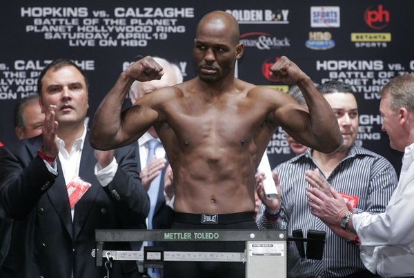 Bernard Hopkins flexes on the scale during his official weigh-in.