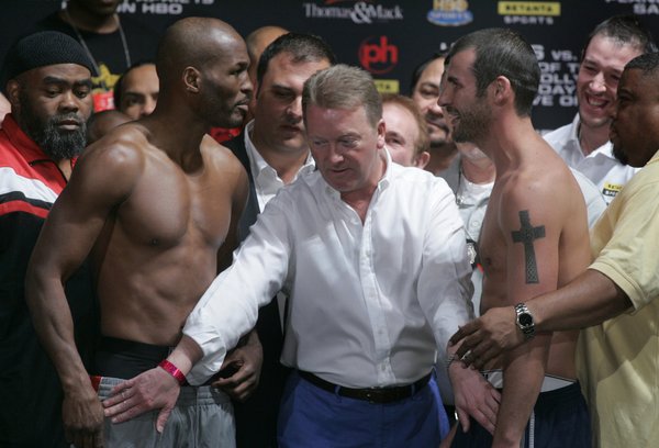 Promoter Frank Warren, center, separates boxers Bernard Hopkins, left, and ...