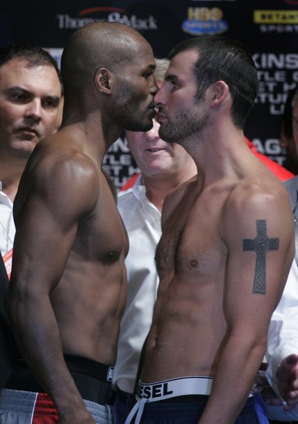 Bernard Hopkins, left, and Joe Calzaghe of Wales face off during the official weigh-in at Planet Hollywood Friday. Hopkins and Calzaghe will fight  at the Thomas & Mack Center Saturday, April 19.