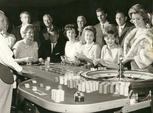 Guests try their luck at roulette while gambling at the ...