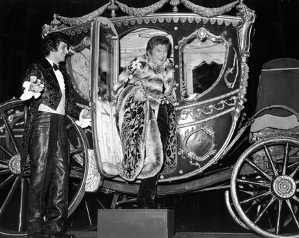 Liberace arrives at one of his shows at the Las Vegas Hilton, in an extravagant horse-drawn carriage. The singer's lavish costumes and stage props were funded by his $125,000 weekly salary.