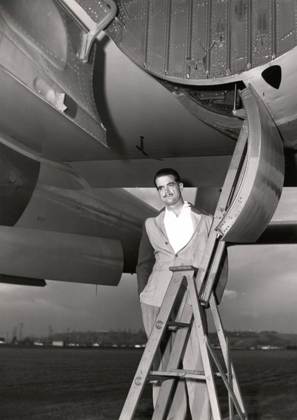 Howard Hughes stands below the second prototype of his XF-11 reconnaissance aircraft in this 1947 photo. The USAF declined to pick up the XF-11 project due to the difficulties involved in flying the plane, and the high cost of manufacturing it.