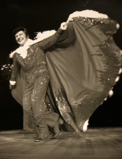Liberace flaunts one of his glamorous costumes during a promotional photo shoot. His memorable performances were immortalized in the video 