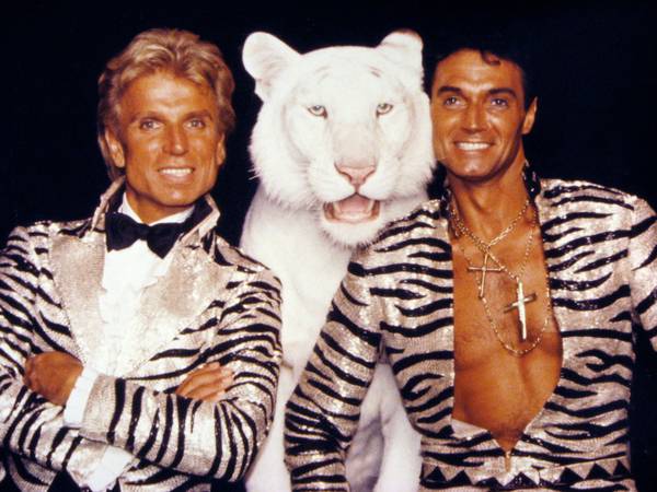 Siegfried & Roy pose with one of their famous White ...