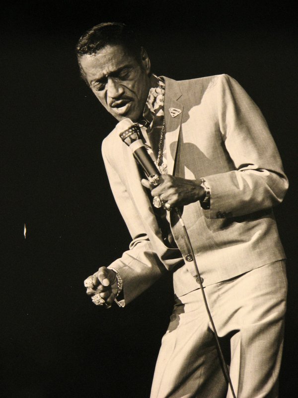 Sammy Davis Jr. snaps his fingers during one of his ...