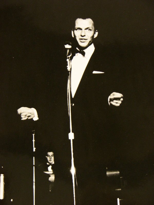 A young Frank Sinatra snaps his fingers while performing on ...