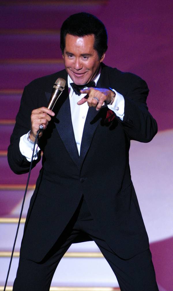 Entertainer Wayne Newton jokes around during a performance at the ...