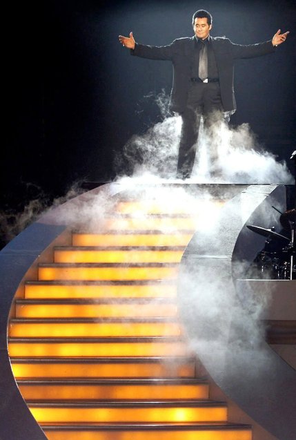 Wayne Newton rises from a hidden lift amidst fog and lasers as he rehearses his grand entry for his millennium concert at the Stardust hotel-casino Friday Dec. 31, 1999. Newton gave one concert New Year's Eve and two performances January 1 as a prelude to his engagement with the Stardust.