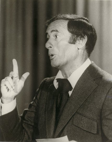 Comedian Joey Bishop speaks to guests during the taping of his talk show 