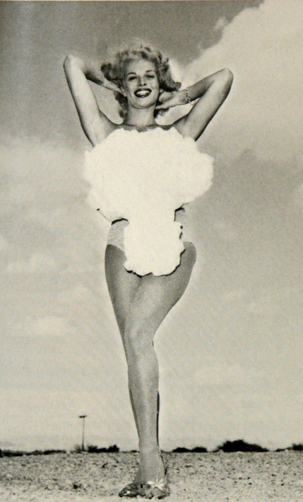 Copa Room showgirl Lee Merlin poses in a cotton, mushroom cloud swimsuit as she is crowned 