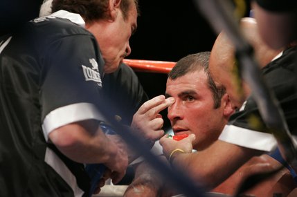 Trainers tend to Joe Calzaghe between rounds.