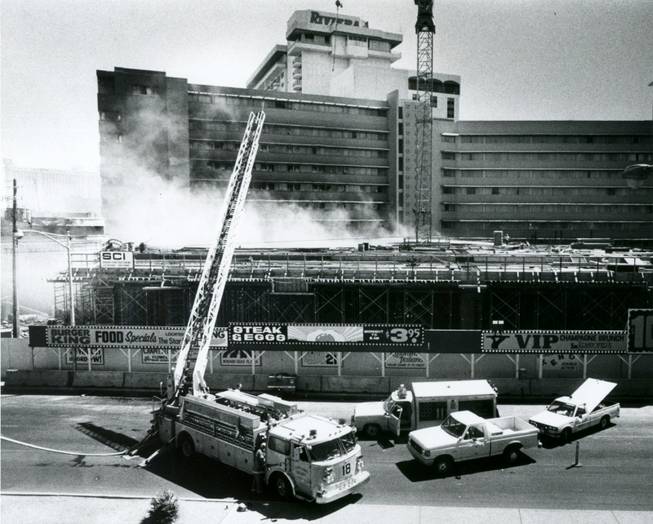 Authorities work to put out the fire at the Riviera ...