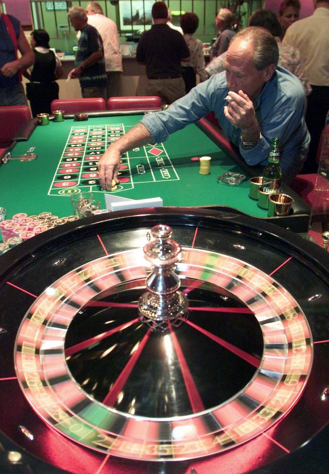 David Reimondo places his bets as the Roulette wheel spins during the grand opening celebration of the Klondike casino in Henderson, Friday, Oct. 1, 1999. The European roulette wheel only has 37 pockets, while the American wheel has 38. 