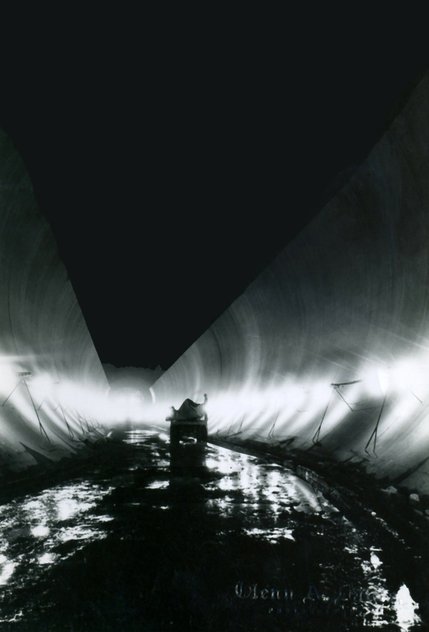 Workers install the ceiling of Diversion Tunnel No. 2, during the construction of the Hoover Dam. Many workers suffered from carbon monoxide poisoning generated by the machines and later died. Six Companies Inc. blamed most of the deaths on pneumonia and and was spared any responsibility. Many of these workers remain undocumented on the official death list.