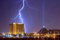 Lightning bolts strike over casinos on the south end of the Strip on July 17, 2006. Thunderstorms are fairly common during the summer months in Las Vegas.