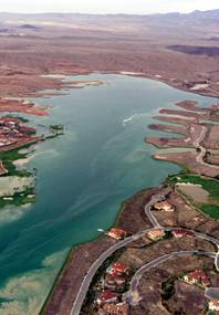 Sediments from flood waters flowed into Lake Las Vegas after a severe thunderstorm dumped more than 3 inches of rain on the Las Vegas Valley on July 8, 1999. Annual rainfall in the valley typically reaches 4 inches. (Aerial photo from KLAS-TV helicopter)