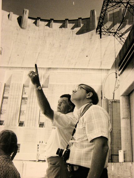 Hoover Dam guide Tom Gailey, gives the dam's 25 millionth visitor, Leroy Zimmerman, a V.I.P. tour of the dam.  Zimmerman and his family, on a month-long vacation from Myerstown, Penn., were also given a photo album/scrapbook of the dam and a free lunch. The Hoover Dam hosts about 10 million visitors each year.