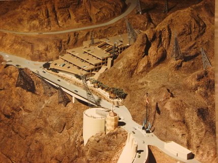 A model of the Hoover Dam in December 1989 shows the visitors center and parking garage. In 1988 and 1989,
U. S. Highway 93 on the Nevada side of the dam was realigned and a new bridge built to carry traffic over the pedestrian walkway, linking the parking garage and the visitor center. An $87.9 million visitors center was completed on June 21, 1995.