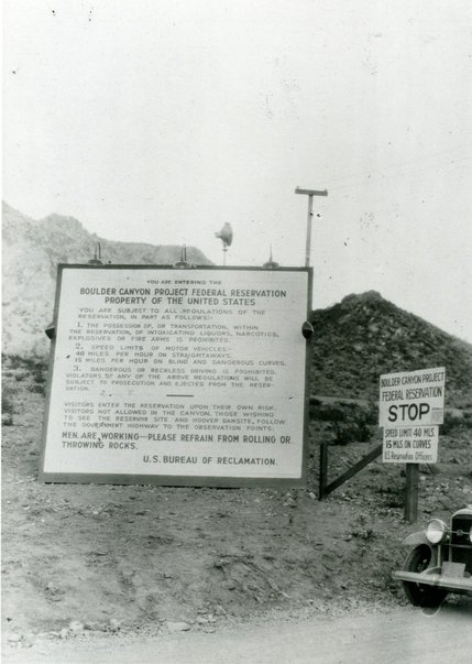 A sign erected at the entrance to the Boulder Canyon Project Federal Reservation, the site of Hoover Dam, on Dec. 1, 1931. The project is originally planned to be built in Boulder Canyon, hence the name, but is eventually moved 8 miles down to Black Canyon. The dam is named after President Herbert Hoover, but for many years goes by the name Boulder Dam.