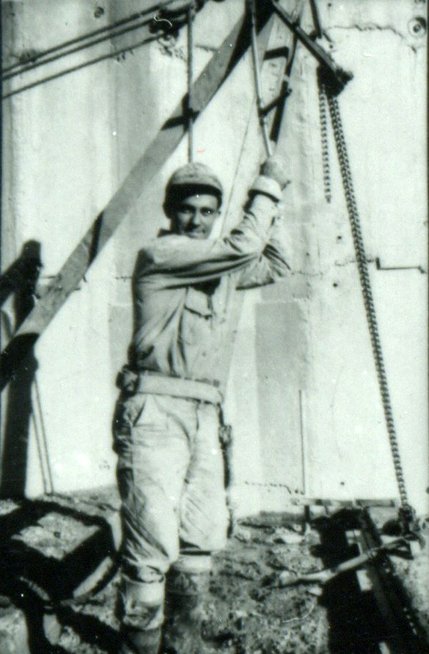 A young Hoover Dam laborer smiles for the camera.