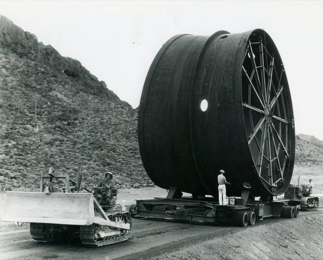 A piece of pipe is towed along to the Hoover Dam. In 1981, the dam is listed on the National Register of Historic Places. Lake Mead, the reservoir that was created behind the dam, is named after construction foreman Elwood Mead. Mead oversaw the construction of the whole project.