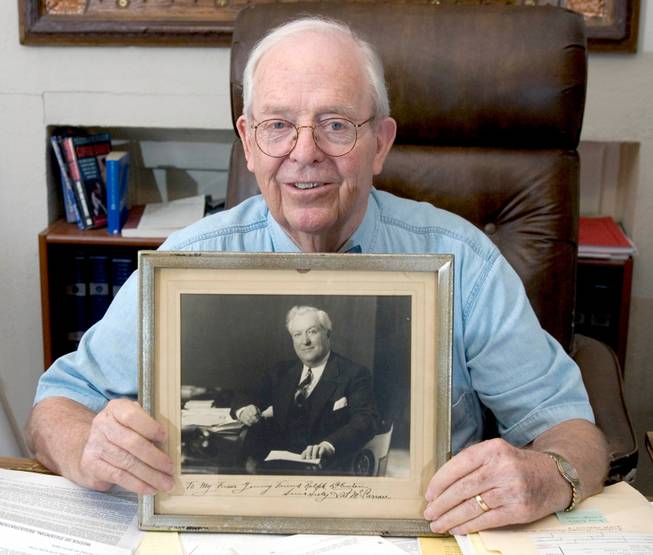 Attorney Ralph Denton holds a photo of Pat McCarran in his office Monday, September 13, 2004.