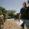 James Bailey has rejected a $163,000 offer from North Las Vegas officials for his house on East Carey Avenue. Because he refinanced the house three times, he owes more than the offer would pay. At left is Suzanne Lovely, one of Bailey's creditors. 