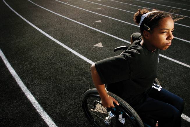 Kiya Smith, 13, will compete in swimming at the International Wheelchair and Amputee Junior World Championships at Rutgers University in July.
