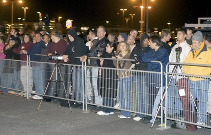 People line up in the parking lot of the New Frontier awaiting the implosion of the final buildings of the former Desert Inn early Tuesday, Nov. 16, 2004, to make way for a second planned hotel tower adjacent to the Wynn Las Vegas. The $2.4 billion first phase of the megaresort is scheduled to open April 28, 2005. 

