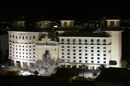 The final buildings of the former Desert Inn begin to fall as they are imploded early Tuesday morning, Nov. 15, 2004. This photo is taken from the 15th floor of the New Frontier hotel tower. 
