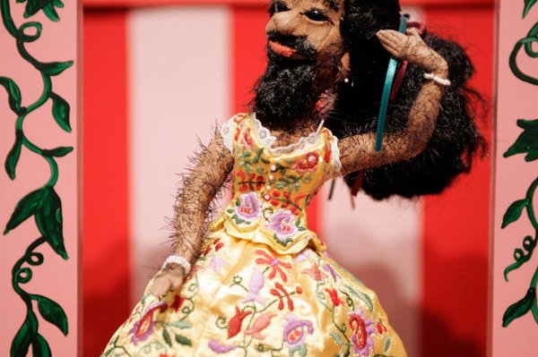 Straight, black hair covered the bearded lady's entire face and ...