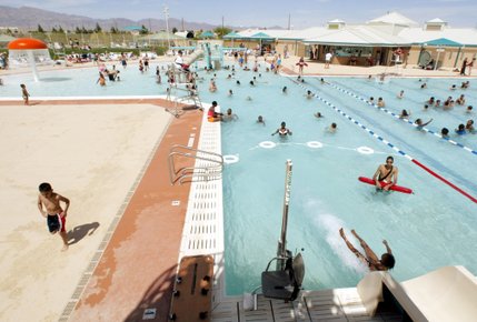 Families frolic inside the pool at the Silver Mesa Aquatics Complex in North Las Vegas. The pool opened on May 19, 2002 and includes a recreation center and an adjacent park. Local high school swim teams in the area train at the center.
