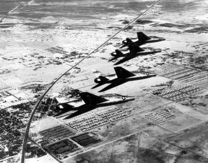 Four F-100 Super Sabre jet fighters maneuver high above Las Vegas. The jets were delivered to Nellis Air Force Base on June 1, 1956, the same day the world famous Thunderbird Air Demonstration Squadron was stationed at Nellis. The Thunderbirds quickly adopted the F-100 as part of their act. 