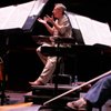 Artistic Director David Itkin, conducting the philharmonic's string section in rehearsal, says 'King David' influenced movie music.