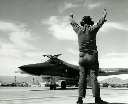 One of the Nellis-based F-111As is readied for taxiing by assistant crew chief Sgt. Marvin L. Niekamp on June 18, 1968. The aircraft was flown for the first time since being restricted from flying on May 8, 1968.