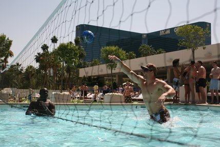 James Lewis, left, and Luke Johnson play pool volleyball during UNLV Nightclub Management class' party at MGM Grand's Wet Republic. 