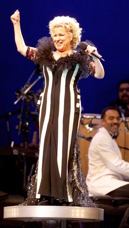 An elevator causes Bette Midler to rise above stage during her 