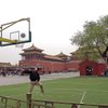 A student shoots the ball in front of the Forbidden City in Beijing. The ball also made stops at the Great Wall and in Guilin, China. 