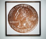 "Monads (Small Change)," a Cibachrome print by Vik Muniz, is on loan from the collection of Frank and Jill Fertitta for the exhibit. 

