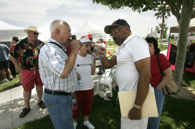 Bill and Nola Asher, left, eat ice cream and chat with Rod and Joan Smalls during the social. Residents say the campaign was a bonding experience.